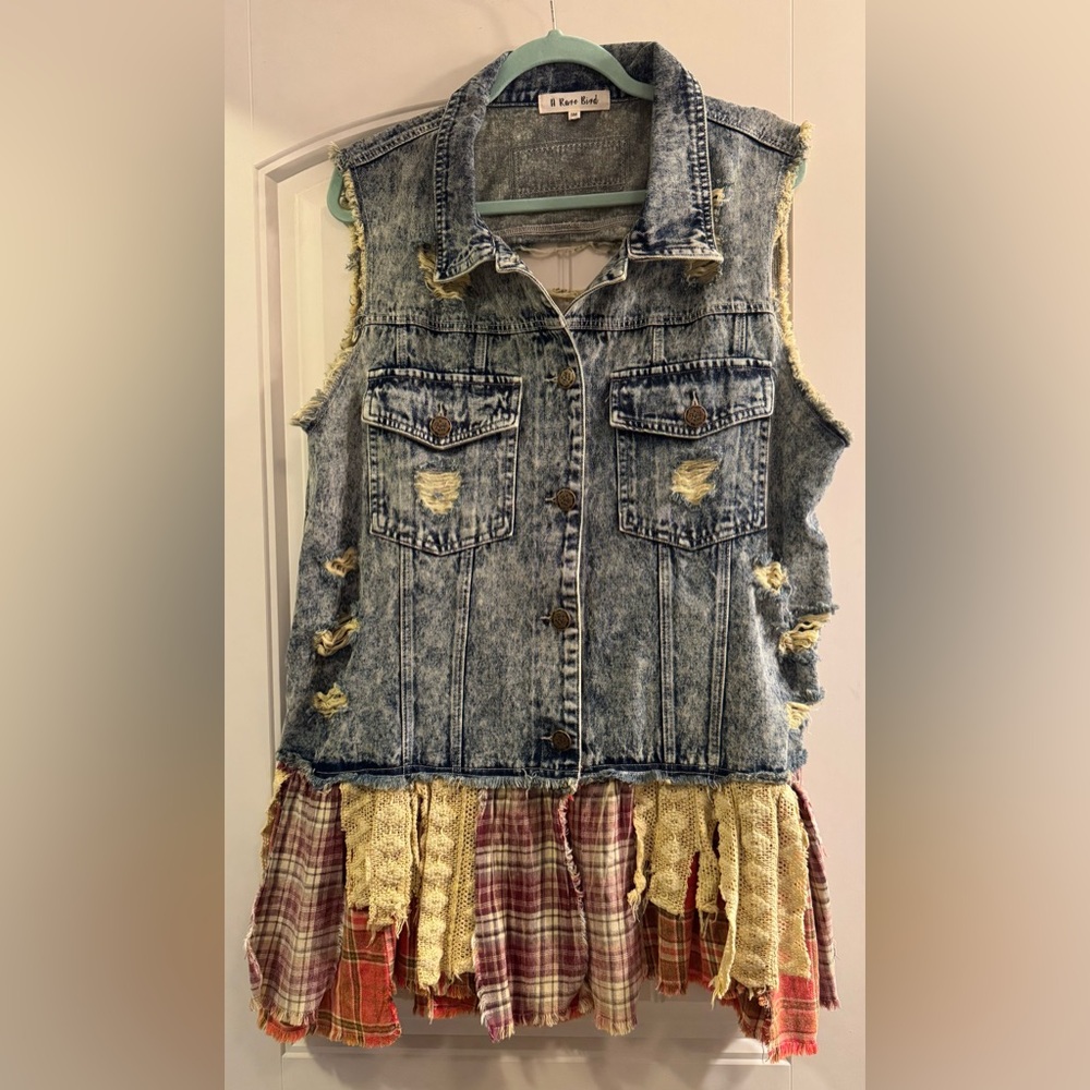 A Rare Bird women’s jean and patchwork fringe vest. Size Small New without tags.